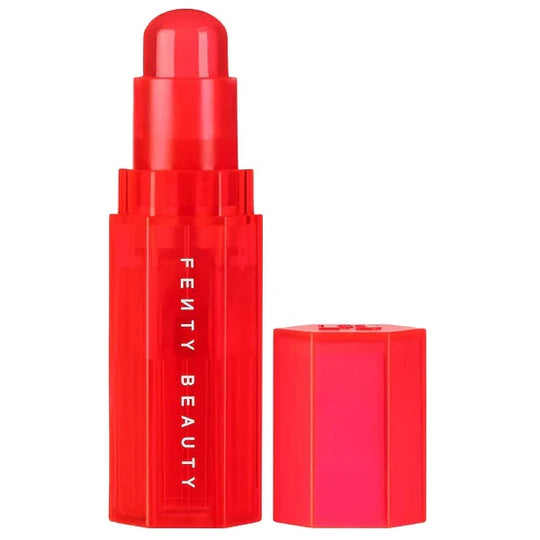 A close-up of the hydrating cheek and lip stick in Strawberry Pop, showcasing its smooth, creamy texture and radiant rosy shade.

