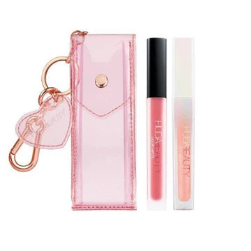 Huda Beauty Cherry Blossom Lip Set packaging showing floral pouch with Lucky 04 liquid lipstick and shimmering Silk Balm