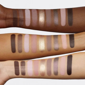 Arm swatches of all 9 Greige palette shades applied on light, medium, and deep skin tones showing consistent pigment payoff across complexions - featuring cream-to-matte, metallic and marbleized textures