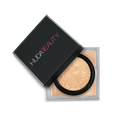 HUDA BEAUTY Easy Bake Loose Powder packaging in Banana Bread, showcasing product labels like 'Easy Bake Family,' 'Easy Bake & Snatch,' and 'Easy Bake Mini' with brand name and variant details.