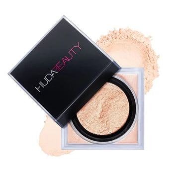 HUDA BEAUTY Easy Bake Loose Powder in Peach Pie shade - luxury pink jar with black lid and gold branding