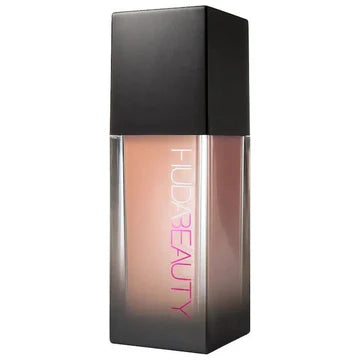 Vegan liquid foundation by HUDA BEAUTY providing luminous matte coverage that conceals acne and scarring, resistant to humidity and fading for all-day wear