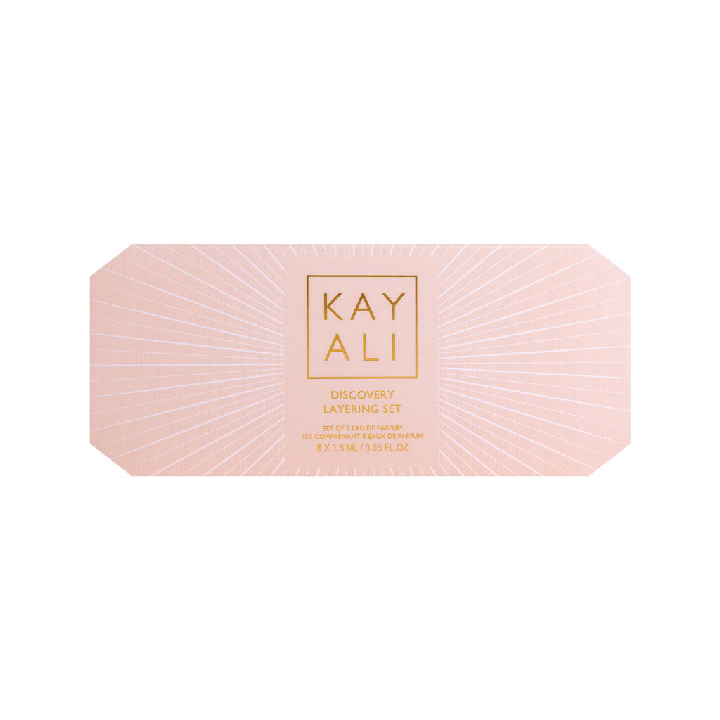 Huda Beauty's KAYALI Discovery Layering Set featuring 8 luxury perfume miniatures (1.5ml each) for creating custom fragrance combinations. The sleek packaging displays the brand's elegant typography with 'KAYALI' prominently featured.
