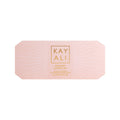 Huda Beauty's KAYALI Discovery Layering Set featuring 8 luxury perfume miniatures (1.5ml each) for creating custom fragrance combinations. The sleek packaging displays the brand's elegant typography with 'KAYALI' prominently featured.