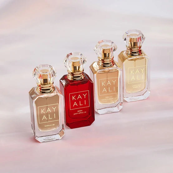 HUDA BEAUTY KAYALI Miniature Perfume Set featuring four 10ml bottles with gold caps, each displaying the KAYALI logo in elegant typography