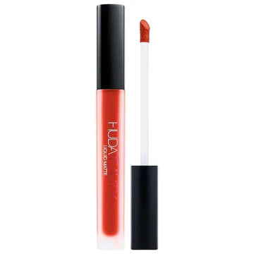 Huda Beauty Liquid Matte Ultra Comfort lipstick tube with matte black packaging and gold logo, showing doe-foot applicator