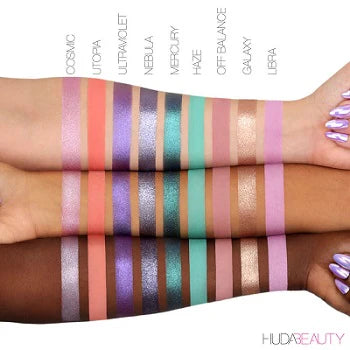 Open view of HUDA BEAUTY's Mercury Retrograde Palette with labeled pans for easy shade selection, featuring buttery mattes and high-shine metallics for seamless blending