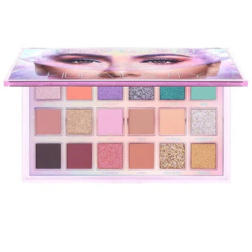 Open view of HUDA BEAUTY's Mercury Retrograde Palette with labeled pans for easy shade selection, featuring buttery mattes and high-shine metallics for seamless blending