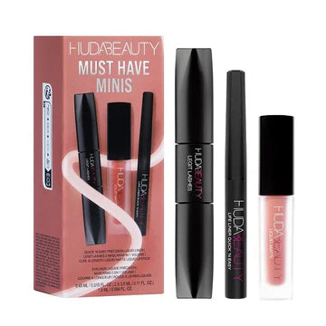 Close-up of Huda Beauty Must-Have Minis Lip & Eye Set showing the collection's logo and gold-accented packaging