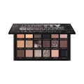 Open Huda Beauty Pretty Grunge palette displaying 9 eyeshadow shades
