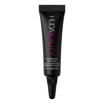 Close-up of HUDA BEAUTY Waterproof Lash Glue packaging showing brand name, product size (0.28 fl oz), and manufacturing origin (Made in China