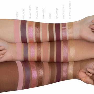 HUDA BEAUTY Naughty Nude Eyeshadow Palette showing nine nude-toned shadows including ROUGH (matte beige), SHOY (soft pink), AROUGE (terracotta), SUPPERLY (champagne shimmer), TAKING (warm brown), MUDNITY (taupe), PROVOCATIVE (deep bronze), GESTIVE (muted mauve), and LUCKY (golden peach) in rectangular pans with shade names beneath each.