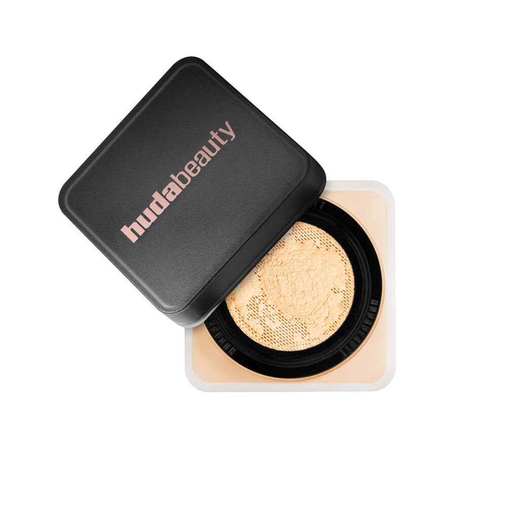 Huda Beauty Easy Bake Loose Powder in Banana Bread shade with packaging displayed


