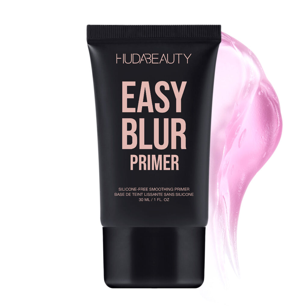 A clean product shot of Huda Beauty’s Easy Blur Primer in its 30ml bottle. The silicone-free smoothing primer is showcased with elegant branding, including the tagline 'Silicone-Free Smoothing Primer' and its French translation. The minimalist presentation highlights the luxurious packaging, emphasizing its lightweight, pore-blurring formula for a flawless makeup base