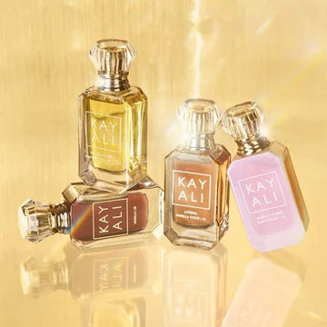 All four KAYALI vanilla mini perfumes lined up together