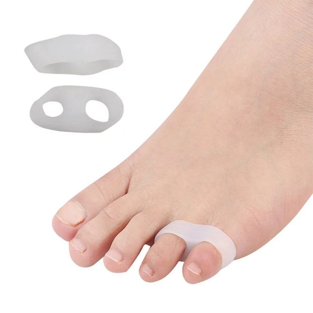 Bunion correctors on a foot with a white background