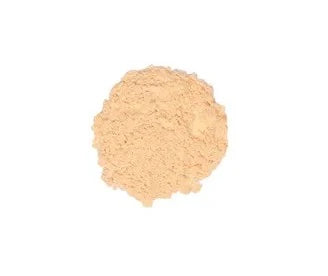 Close-up of Huda Beauty’s lightweight loose powder with a soft-focus finish, designed for shine control and long-lasting wear
