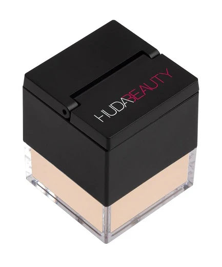 Huda Beauty Easy Bake Loose Powder in a jar, a silky translucent powder for matte, luminous makeup setting and baking