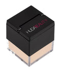Huda Beauty Easy Bake Loose Powder in a jar, a silky translucent powder for matte, luminous makeup setting and baking