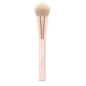 HUDA BEAUTY angled synthetic blush brush with tri-length fibers for diffused application of cream, gel or powder products, showing the antibacterial bristles and ergonomic handle