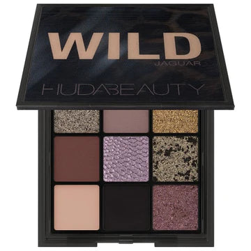 Huda Beauty Wild Obsessions Eyeshadow Palette in Jaguar - Mini 9-pan palette featuring smoky purples, sparkly grey, and matte black shadows with 3D python-embossed shimmer.