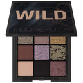 Huda Beauty Wild Obsessions Eyeshadow Palette in Jaguar - Mini 9-pan palette featuring smoky purples, sparkly grey, and matte black shadows with 3D python-embossed shimmer.