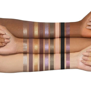 Huda Beauty Wild Obsessions Eyeshadow Palette in Jaguar - Mini 9-pan palette featuring smoky purples, sparkly grey, and matte black shadows with 3D python-embossed shimmer.