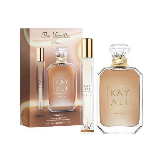 A large bottle of Huda Beauty Kayali The Vanilla perfume with a gold cap, featuring the text 'The Vanilla Duo' and 'KAYALI' branding. The label includes 'VALLEA 13,' suggesting a variant or fragrance note