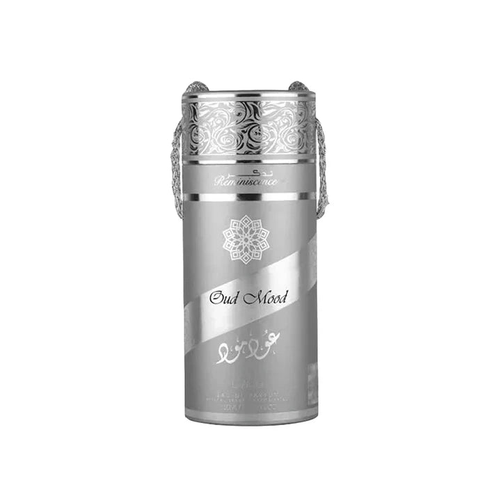 Silver and white perfume bottle with intricate designs on a white background