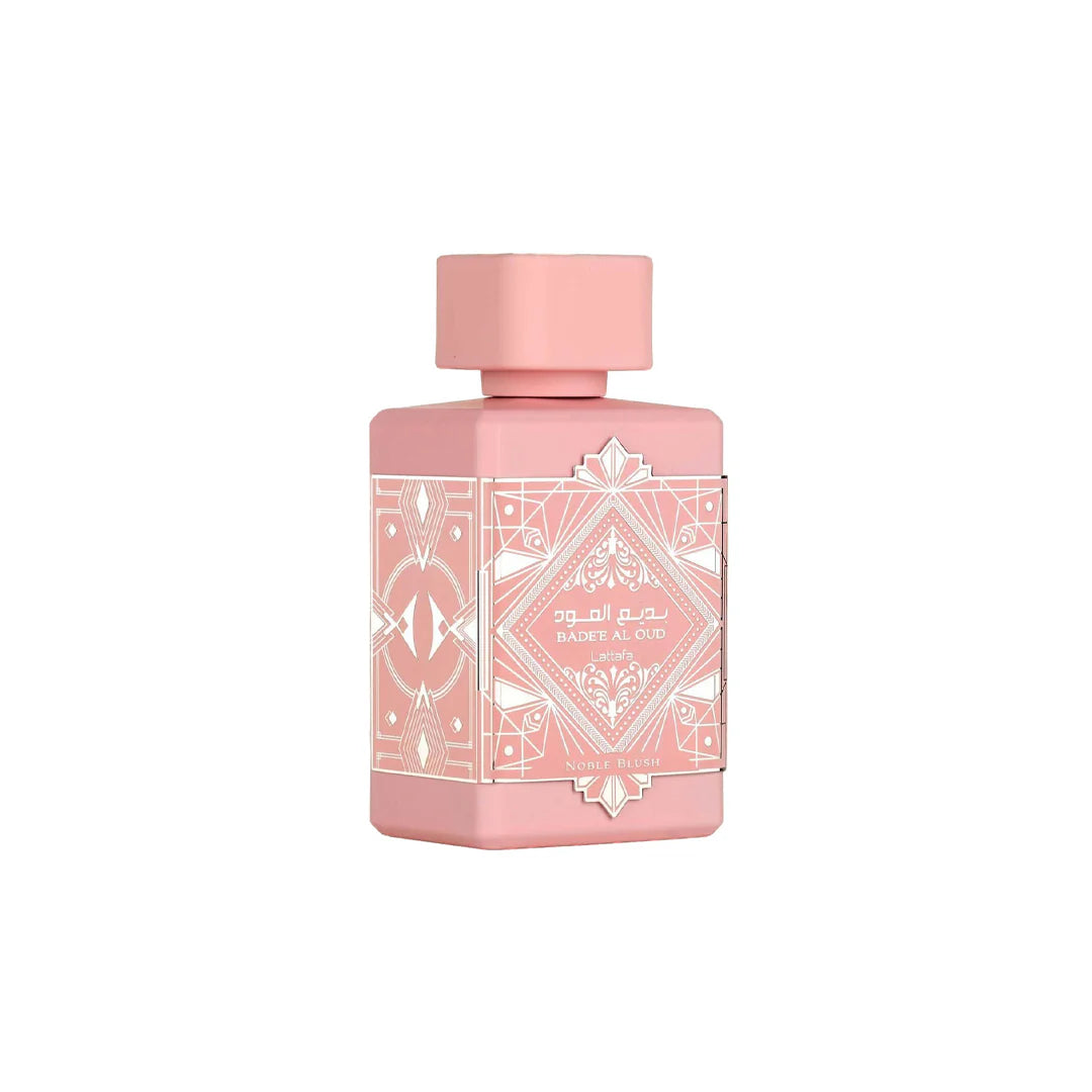 Pink perfume bottle with geometric design on a white background
