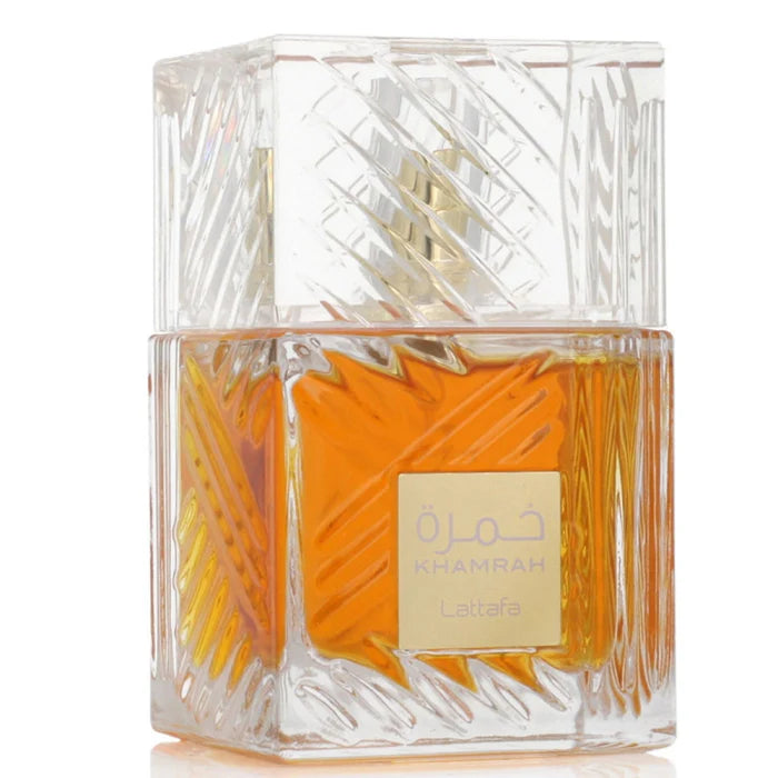 Perfume bottle with gold label on a white background