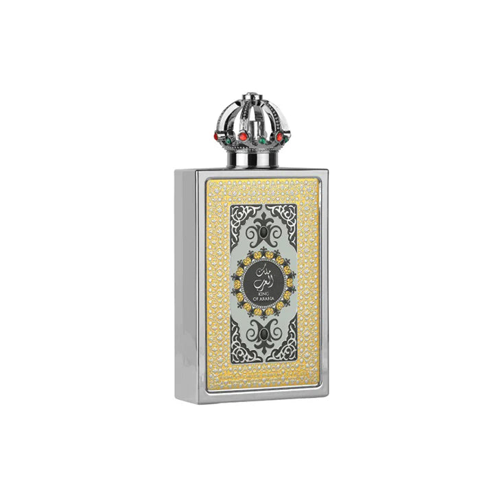 Decorative perfume bottle with intricate design on a white background
