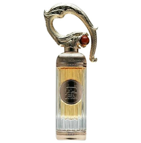 Decorative perfume bottle with gold cap and clear body on a white background