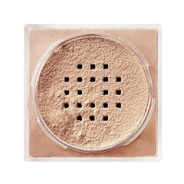 “Close-up of powder application using a fluffy makeup brush on cheek area”

