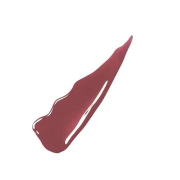 “Close-up of Maybelline Super Stay Vinyl Ink lipstick in shade 40 Witty with rich mauve pigment and glossy finish”

