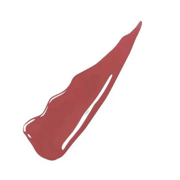 Model wearing glossy nude Vinyl Ink lipstick with radiant finish


