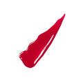 Woman wearing a light nude Super Stay Vinyl Ink lipstick with a glossy finish, smiling confidently.

