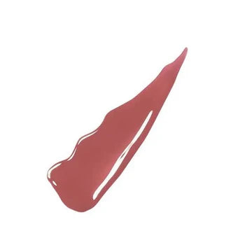 "Model wearing Super Stay Vinyl Ink lipstick in a glossy nude shade with a radiant finish"

