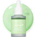 Green skincare serum bottle with dropper on a light green background