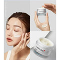 Medicube cream with a woman applying it to her face on a gray background