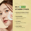 Vegan vitamin C pads advertisement with a woman applying them to her face.