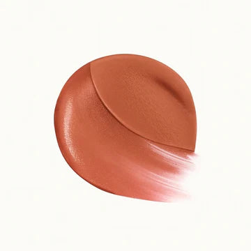 Close-up of lip cream applicator with smooth velvet-matte swatch

