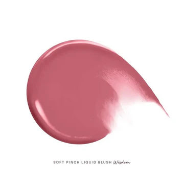 Model applying blush and highlighter for a soft, radiant finish