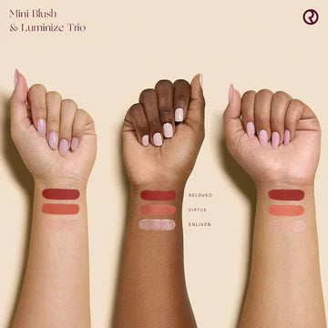 Flat lay of Rare Beauty glow set featuring two blushes and a luminizer in soft peach tones