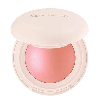 Model wearing blush with a glowy, sun-kissed look on her cheeks in natural daylight.

