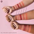 Liquid eyeshadow applicator gliding across eyelid, blending to a soft satin finish.

