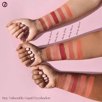 Liquid eyeshadow applicator gliding across eyelid, blending to a soft satin finish.

