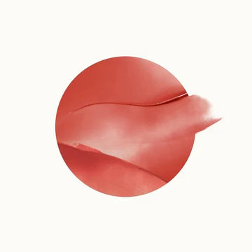 Compact blush in open view with creamy dome-like surface

