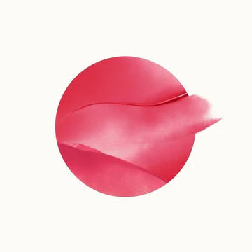 Compact blush container open, revealing vibrant color and soft formula.

