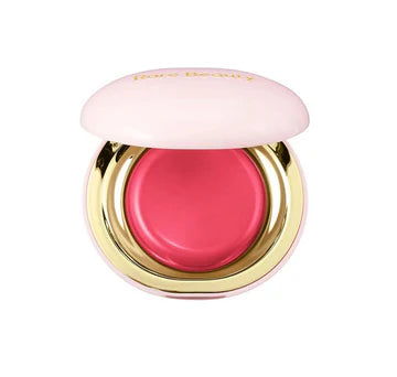 Compact blush container open, revealing vibrant color and soft formula.

